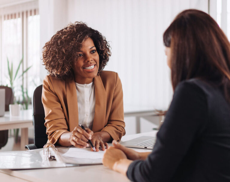 womanconsultingwithafemalefinancialmanageratthebank